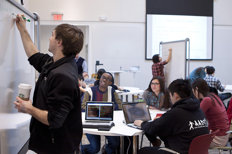 As enrollments in CS have grown dramatically in recent years, the faculty have pioneered a variety of innovative teaching techniques, including the “flipped classroom” approach (shown here in Harry Lewis’ CS 20, a math course for CS concentrators) in which students use class time to solve problems collaboratively instead of listening to lectures. --Photo by Eliza Grinnell, SEAS Communications.