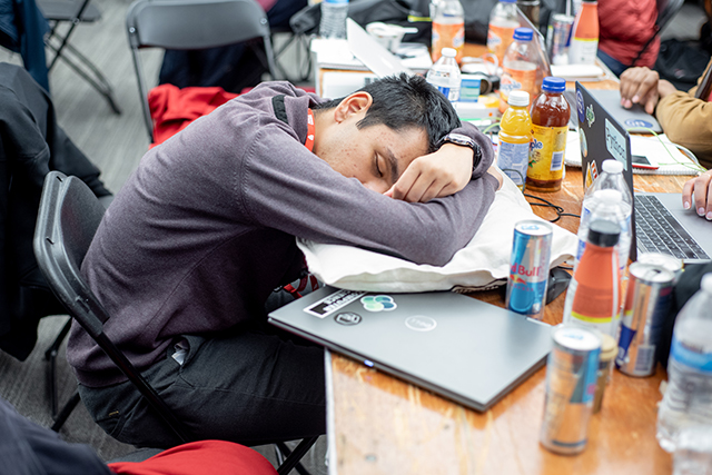 During the 36-hour HackHarvard, adrenaline, energy drinks, and an interest in tackling complex problems with computer science solutions fueled students’ drive to keep hacking. (Photo by Oleksandr Babii)