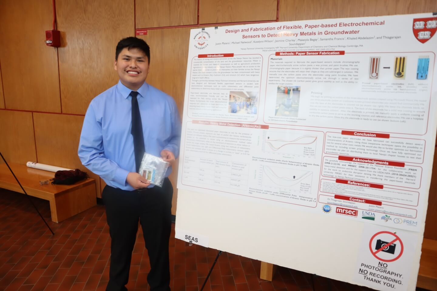 Justin Platero with his research