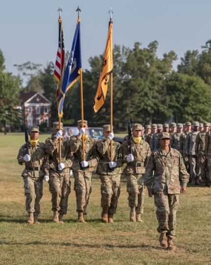 Cadet Gayatri Balasubramanian leads the color guard during graduation at Fort Knox, Ky., August 2019.