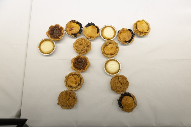 A collection of small pies arranged into the Greek symbol pi